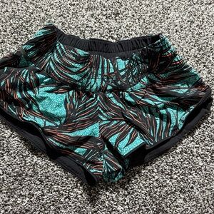 Lululemon Women's Black and Teal Patterned Shorts size 2